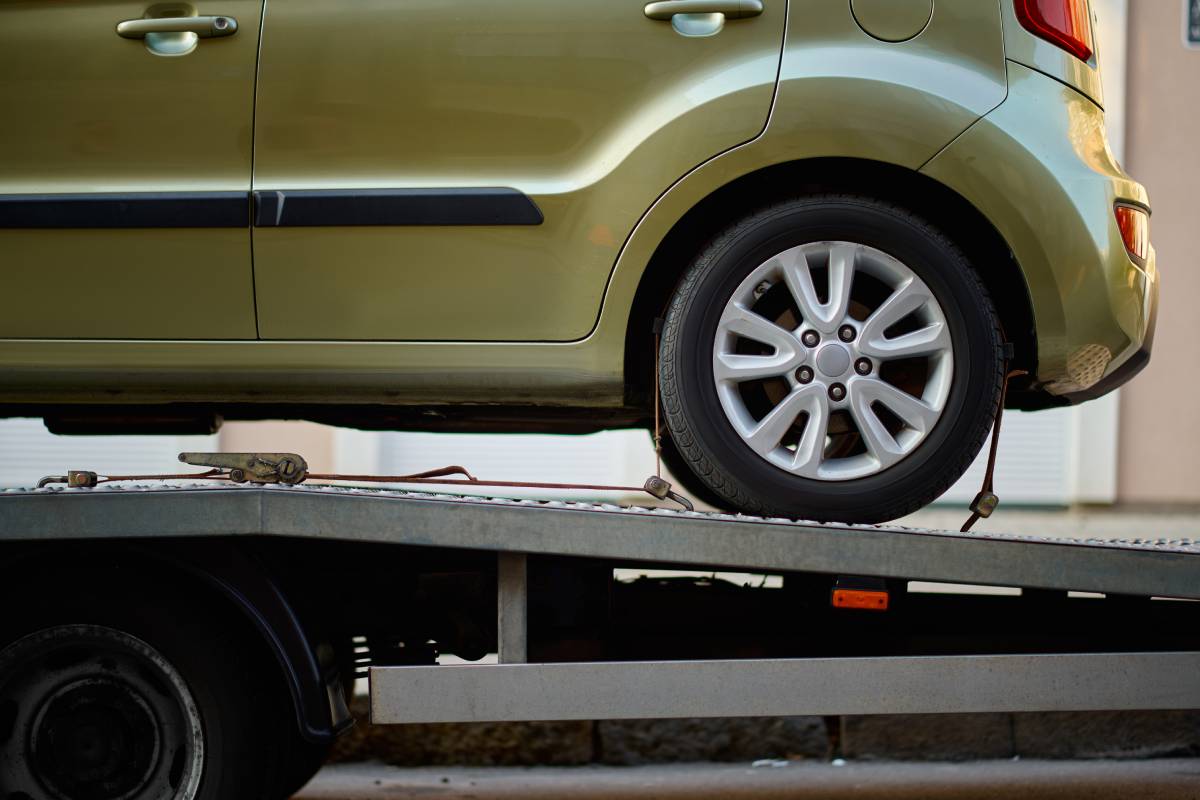 Closeup car fixed on tow truck vehicle